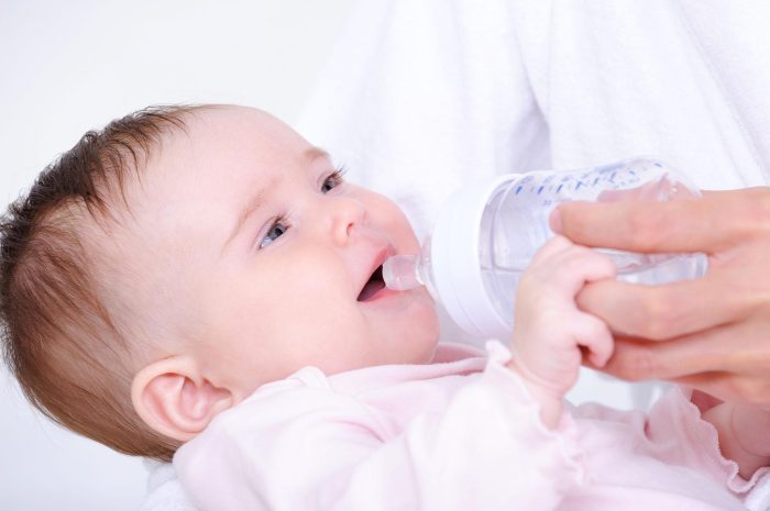 little-baby-drinking-milk-from-bottle