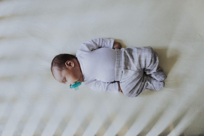 Peaceful baby sleeping in a crib